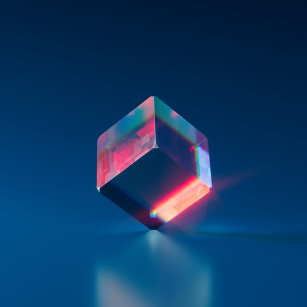 a glassy cube reflecting colors